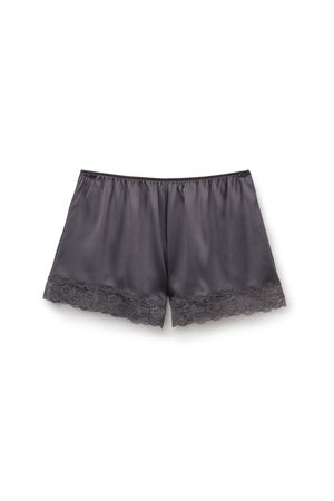 Mörkgrå satintrosor med en jämn yta. Har spetskant vid fållen, resår i midjan och en lös passform.