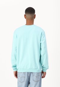 Marimekko LOISTO UNIKKO UNISEX - Melegítőfelső - turquoise