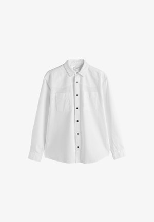 Fehér, hosszúujjú ing, gombos gallérral, két mellzsebbel és fekete gombokkal. Texturált anyag, tiszta, minimalista dizájnnal.