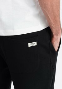 Ombre Jogginghose - black