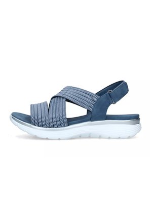 Sandalo blu con cinture di tessuto intrecciato, tacco regolabile e suola bianca ammortizzata progettata per il comfort e la flessibilità.