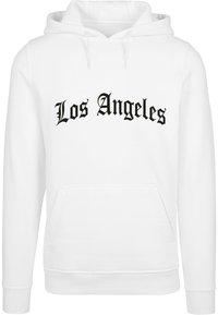 Biela mikina s kapucňou a predným kangaroo vreckom. Obsahuje čierny nápis "Los Angeles" v štýlovom písmene cez hruď. Mäkka tkanina, rebrované manžety.