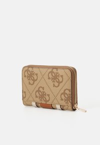 Brown zip-around wallet with logo pattern, textured canvas material, and contrasting light and dark accents. Features a gold zipper.