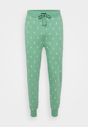 Pantalons de survêtement verts avec taille élastique à cordon, ornés d'un imprimé répétitif de joueur de polo blanc. Tissu doux et extensible avec des poignets ajustés.