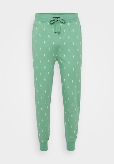 Pantalons de survêtement verts avec taille élastique à cordon, ornés d'un imprimé répétitif de joueur de polo blanc. Tissu doux et extensible avec des poignets ajustés.