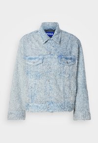 Light blue textured button-up jacket with collar, two chest pockets with flaps, and a small blue logo tag on the left pocket.