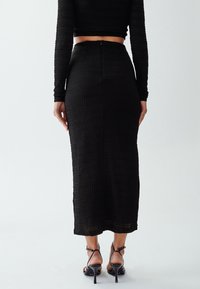 CALLI TIA - Maxisukňa - black
