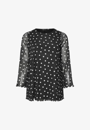 Schwarzes Oberteil mit weißen Punkten. Transparente lange Ärmel, runder Ausschnitt und Rüschensäume. Lässige Passform und leichtes Material.
