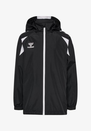 Veste de sport noire à capuche avec fermeture éclair blanche, accents blancs aux épaules, poignets élastiques, et logo blanc Hummel sur le côté gauche de la poitrine.