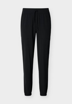 Pantalon de jogging décontracté noir avec taille élastique, cordon de serrage, poches plaquées à l'avant et poignets élastiques, présenté sur fond blanc.