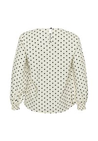Krämfärgad blus med svarta prickar, med långa puffärmar och en nyckelhålsöppning i ryggen. Slät tyg med elastiska manschetter.