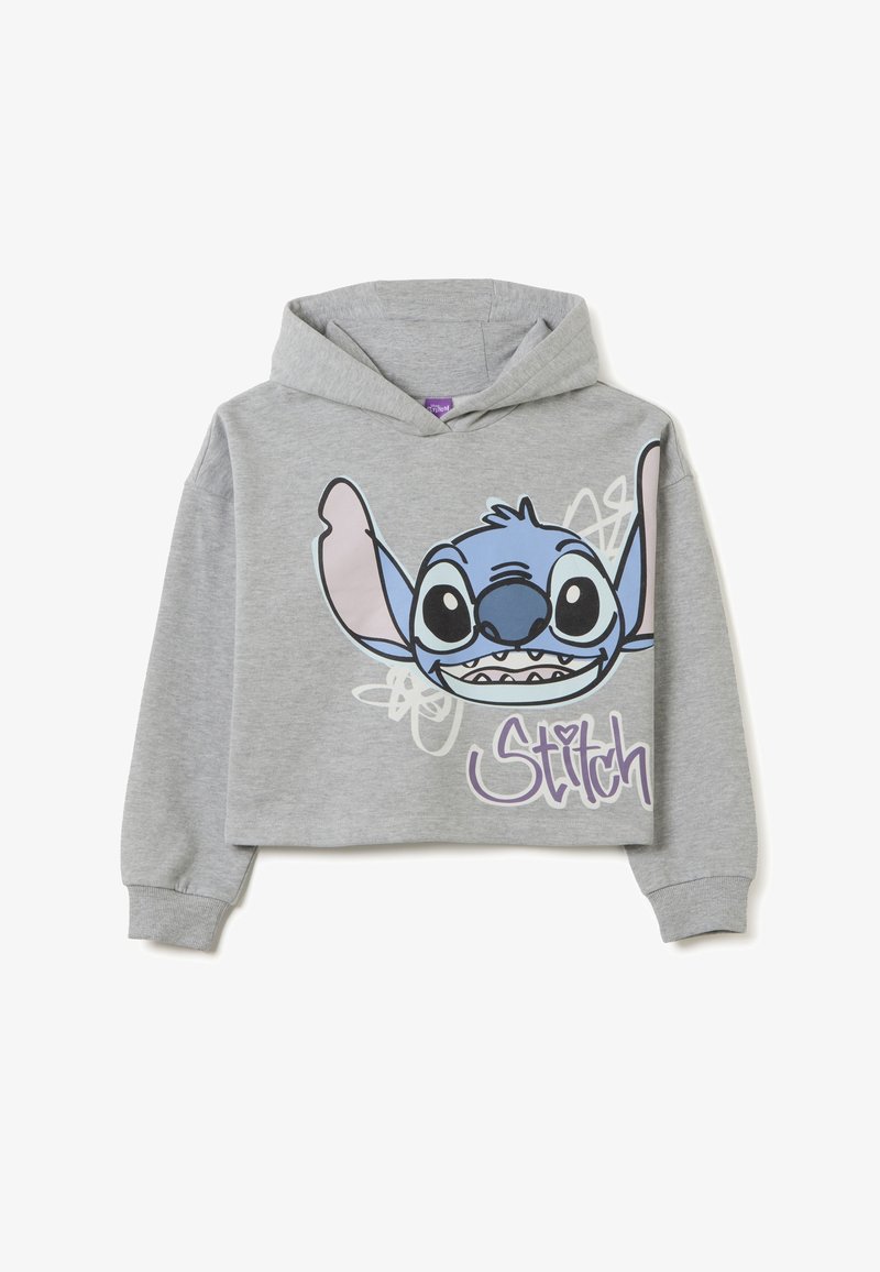 Felpa grigia corta con un grande personaggio cartoonesco blu con grandi orecchie, sorridente, accanto al testo "Stitch" in viola.