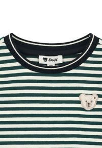 Green and white striped shirt with a round neck, featuring a bear embroidered patch on the left side and a dark ribbed neckline.