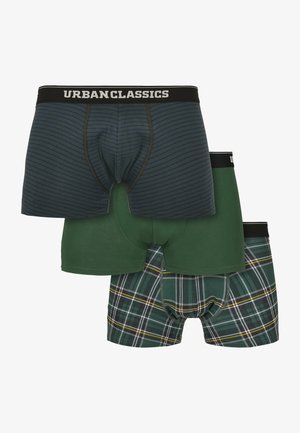 Trois boxers pour hommes dans des tons verts : rayé, uni et à carreaux, chacun avec une ceinture noire portant l'inscription "URBAN CLASSICS".