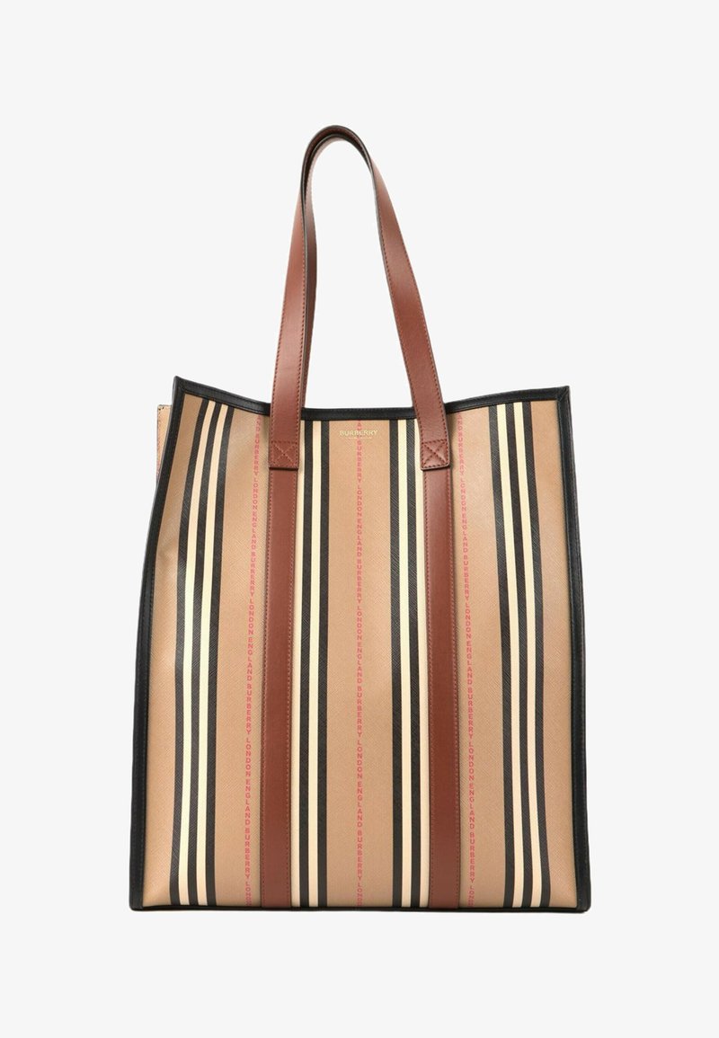 Grand sac cabas avec des rayures verticales beige, noire et crème, des poignées en cuir marron et un subtil détail de texte rouge.