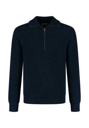 Suéter de punto acanalado en color navy con cuello con cremallera, mangas largas y puños ajustados. Presenta un tejido texturizado que proporciona calidez y comodidad.