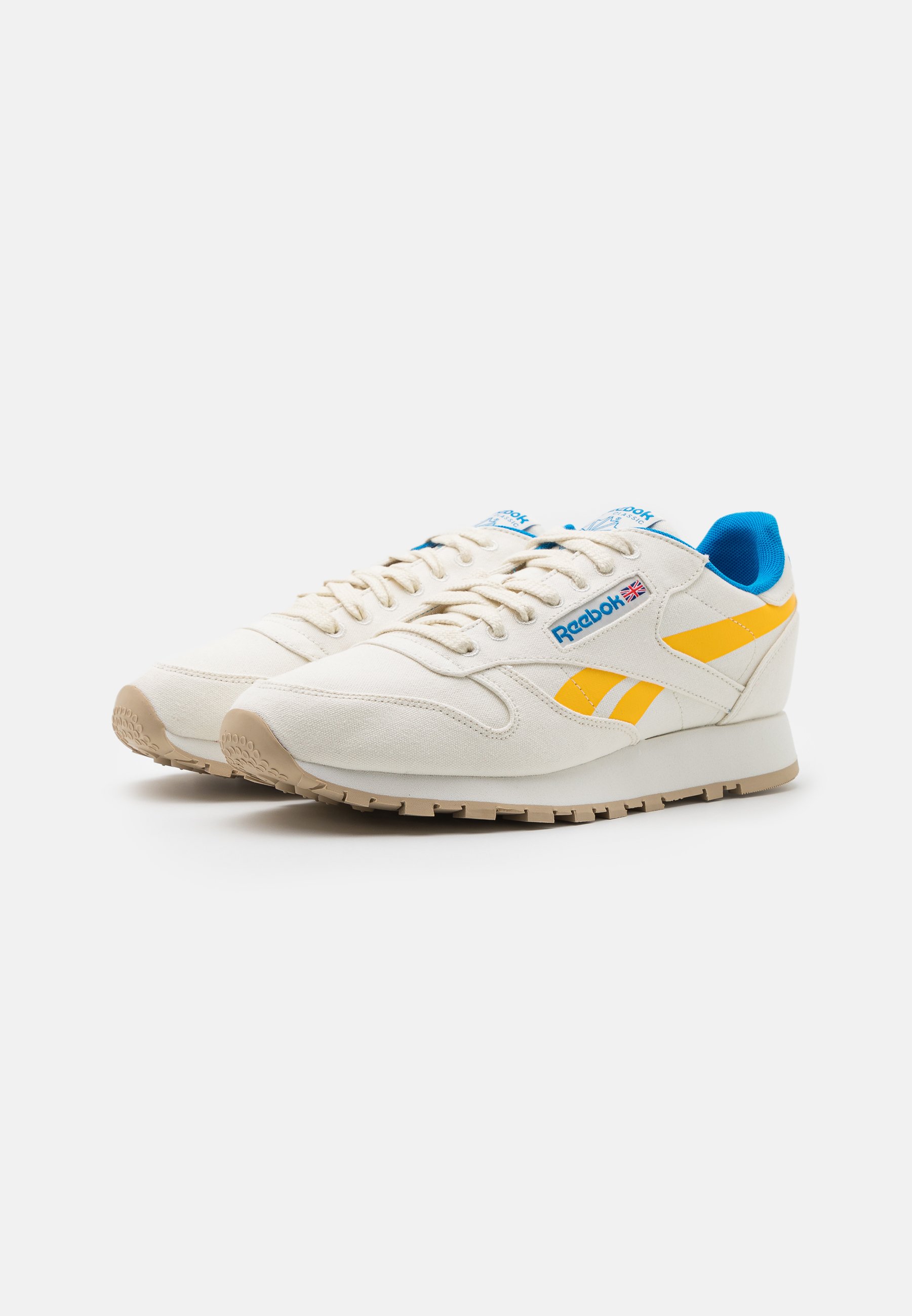 blue and yellow reebok classic