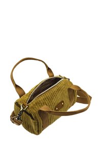 Sac en velours côtelé jaune avec une surface texturée, des sangles marron, une fermeture éclair et une doublure à motifs, présentant une écusson logo sur le côté.