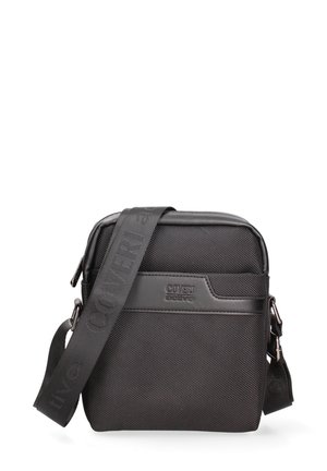 Sac bandoulière noir texturé avec sangle ajustable et logo embossé "Coveri active" sur le panneau avant.