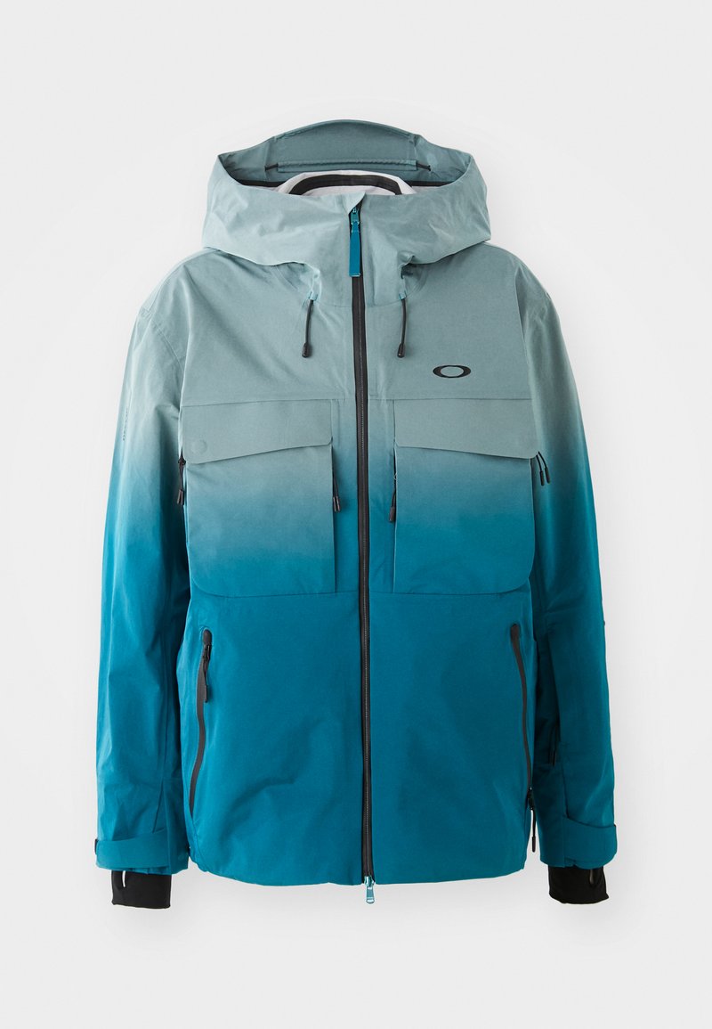 Blå og teal gradient jakke med hætte, to brystlommer, sidelomme med lynlås, justerbare ærmer og et logo på brystet.