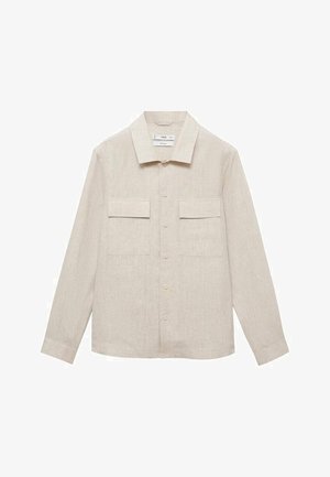 Linned skjorte i lys beige med knaplukning fortil, spids krave, to brystlommer og lange ærmer. Stof har en struktureret overflade.