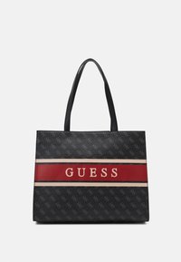 Czarna torba na ramię z wzorzystym zewnętrzem, czerwono-beżowymi poziomymi paskami oraz centralnym logo "GUESS". Posiada podwójne uchwyty.