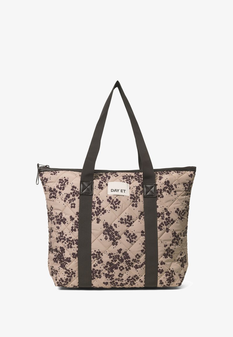Torba tote w kolorze beżowym, pikowana, z ciemnym wzorem w kwiaty. Posiada dwa ciemne uchwyty i zamek błyskawiczny. Na froncie znajduje się metka marki "DAY ET".