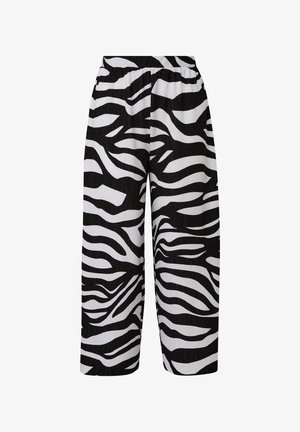 Spodnie o szerokich nogawkach w czarno-białym wzorze zebry. Wykonane z lekkiego materiału z elastycznym paskiem w talii dla komfortu.
