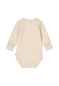 Long-sleeve baby bodysuit in soft beige cotton. Features a round neckline, snug cuffs, and snap closures at the bottom. Smooth texture.