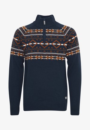 Trikotēts tumši zils džemperis ar rāvējslēdzēja apkakli. Piedāvā ģeometrisku rakstu oranžā, brūnā un baltā krāsā krūtīs un plecos. Gluda tekstūra.