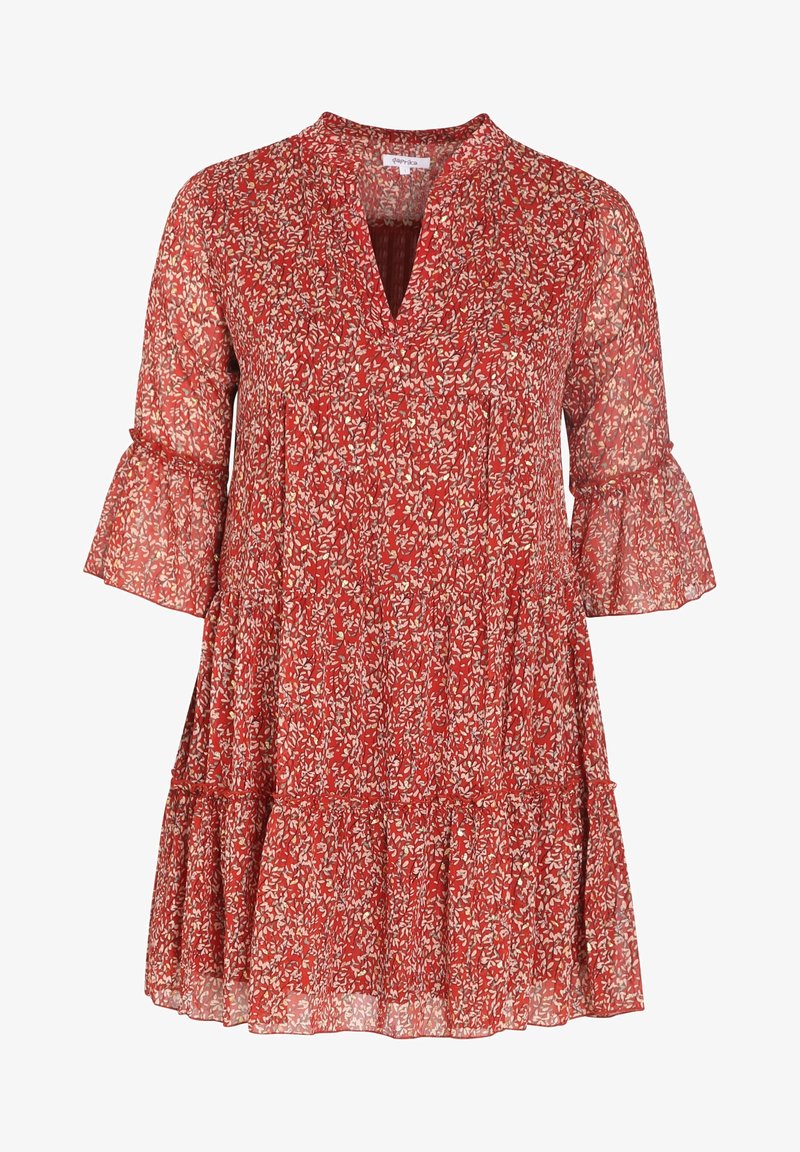 Punainen kukkamekko, jossa on V-mallinen kaula-aukko, leveät hihat ja kerroksellinen helma. Valmistettu kevyestä, läpinäkyvästä kankaasta, jossa on pieniä valkoisia lehtikuvioita.