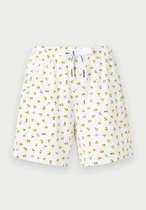 Weiße Shorts mit elastischem Bund, gelbem Zitronenprint und weißem Kordelzug mit schwarzem "Hugo" Schriftzug, dargestellt vor hellem Hintergrund.
