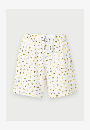 Hvite shorts med elastisk midje, gul sitrontrykk og hvit snor med svart "Hugo"-tekst, vist på lys bakgrunn.