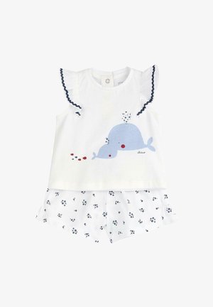 Ensemble short en coton blanc avec un motif de baleine bleue. Manches à volants avec un liseré bleu marine. Shorts à motif floral bleu marine sur fond blanc.