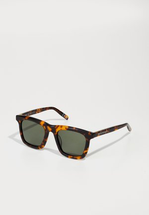 Tortoiseshell sunglasses with dark lenses, square frame design, and smooth plastic texture. Branding visible on the arm.