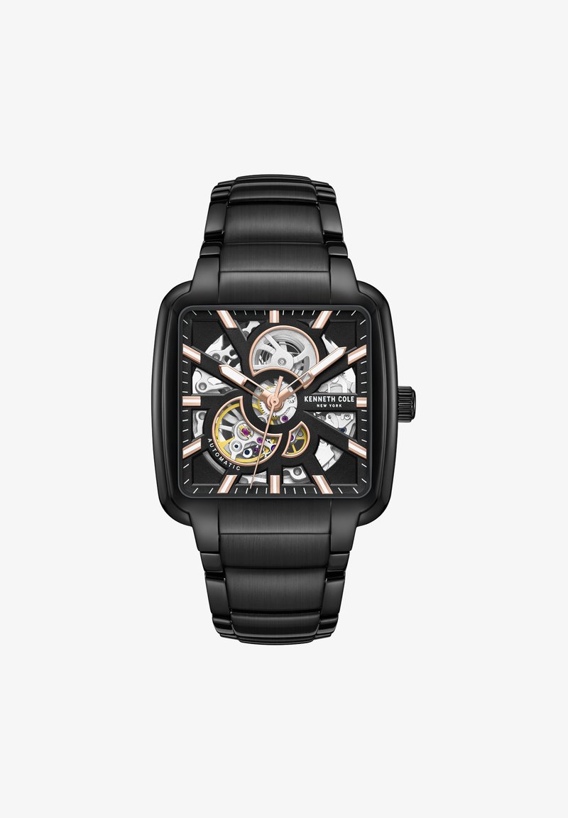 Reloj automático cuadrado con caja y pulsera de acero inoxidable negro. La esfera negra presenta componentes mecánicos en oro y plata; acentos en oro rosa.