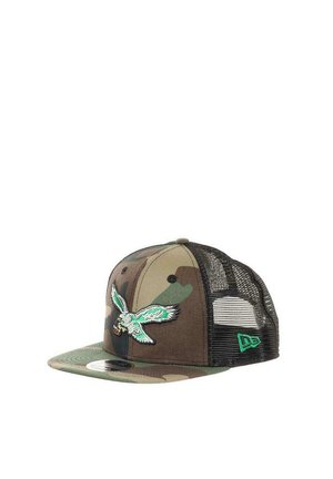 Camouflage baseball cap with mesh back and a flying eagle embroidered on front holding a football in its talons.