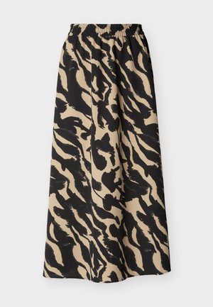 Jupe midi imprimé animal beige et noire avec taille élastique et tissu fluide.