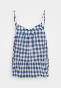 Haut à bretelles fines à carreaux bleus et blancs, avec un corsage froncé et un ourlet à volants, fabriqué dans un tissu léger et respirant.