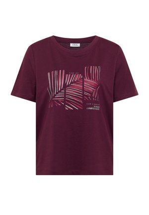 Burgundské tričko s krátkým rukávem a kulatým výstřihem, abstraktní pruhovaný design a text „Najdi radost“ a „Dej si pauzu, buduj sebevědomí“ na přední straně.