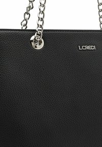 Black leather handbag with distinct grain texture, silver chain handles, and L.CREDI logo. Features metal accents and a structured design.