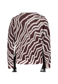 Brun och vitmönstrad tröja med en texturerad yta, som har ett vågigt mönster och svarta accenter på ärmarna.