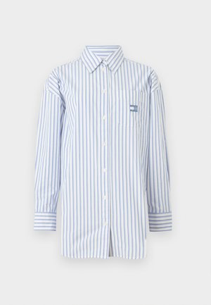 Gombos ing kék és fehér függőleges csíkokkal, hosszú ujjú és mellzsebbel. Könnyű anyagból készült, gallérral rendelkezik.