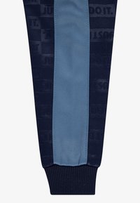 Nike Sportswear TEXTURED CLUB TRICOT SET - Spodnji deli trenirk - midnight navy