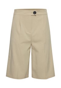 Beige Culottes mit flachem Vorderteil, ausgestattet mit doppelten Falten und einem einzelnen schwarzen Knopf am Bund. Hergestellt aus einem glatten, leichten Stoff.