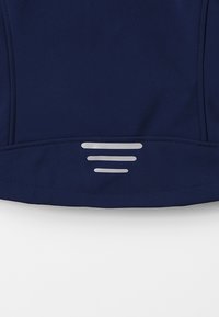Navy outerwear fabric with a smooth texture. Features three horizontal reflective stripes on the lower edge. Stitch detailing along seams.