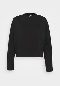 Svart cropped sweatshirt i mjukt material med långa ärmar. Har en liten, präglad Nike-logga på vänster bröst.