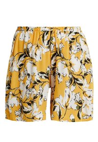 Žluté šortky s květinovým vzorem, které mají bílé květiny a zelené listy, elastický pas a strukturovanou látku.