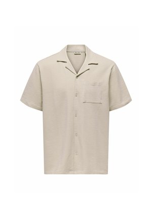Chemise beige à manches courtes avec boutons, en tissu texturé, col campagnard et poche poitrine.