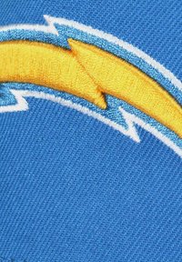 Embroidered patch featuring a yellow arrow on a blue background, with white accents and a textured fabric surface.